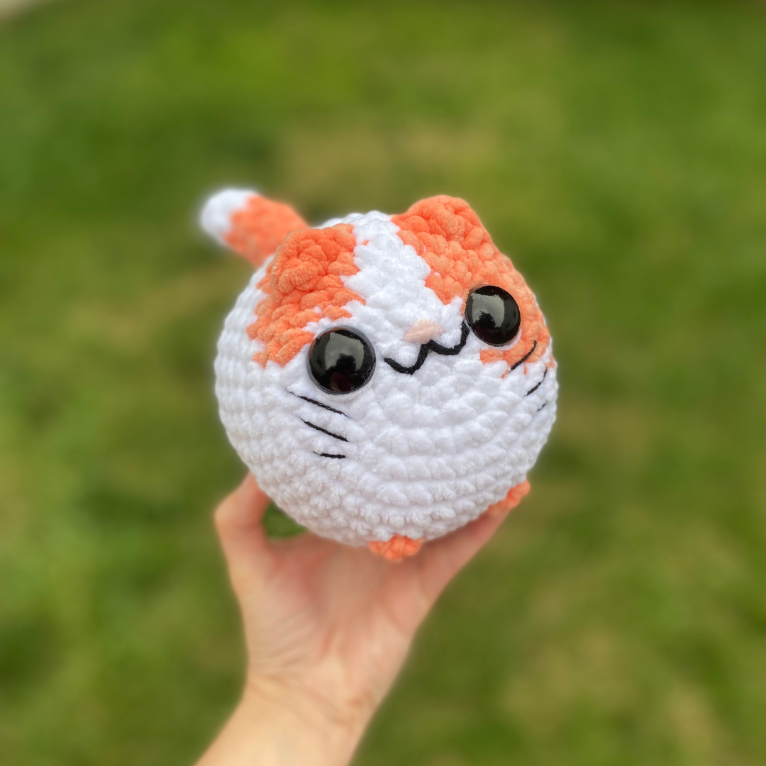 Orange and white loaf cat
